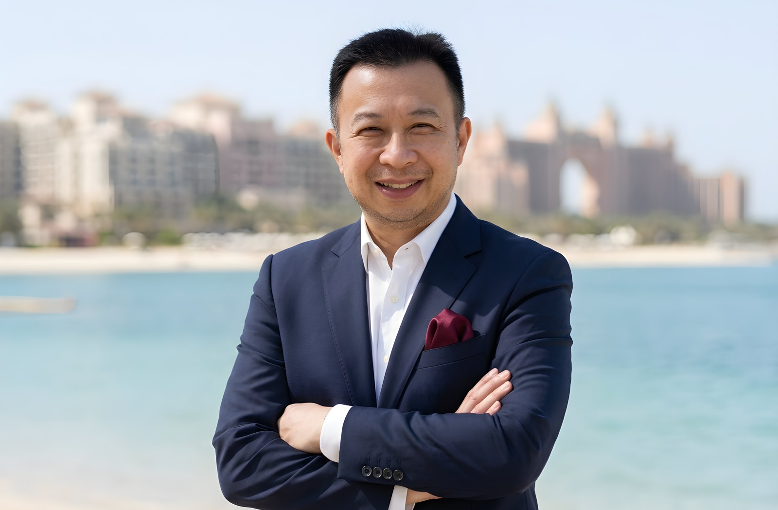 Jack Yan wearing a shirt and navy blazer.
